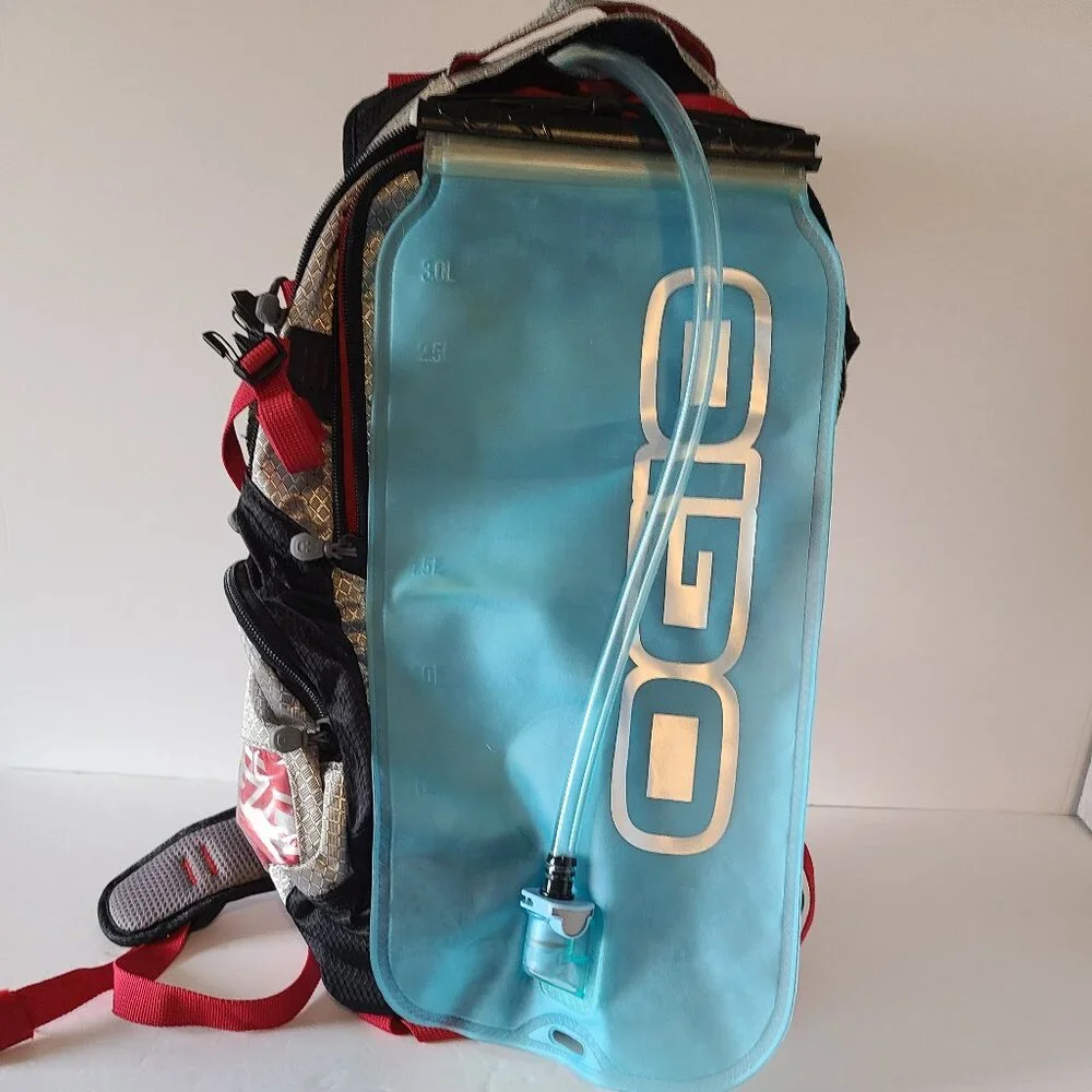 OGIO ATLAS 100 HYDRATION BACKPACK-100 OZ/ 3L BLADDER- CHROME-BLACK/RED ACCENTS